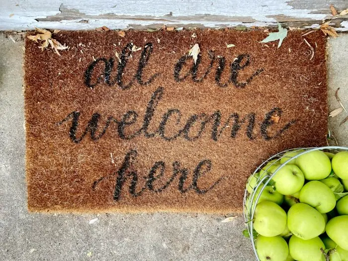 brown and black welcome rug