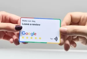 two hands holding review card