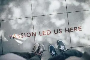 two people standing on gray tile