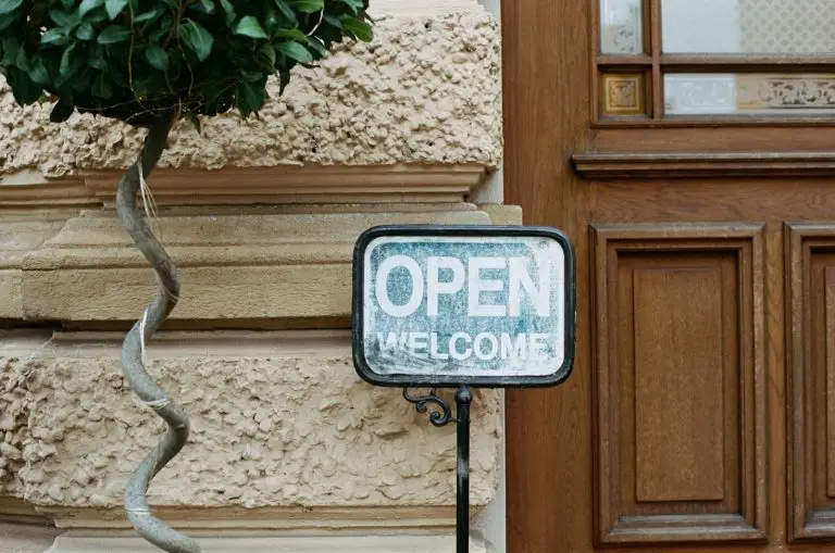 blue and white welcome sign