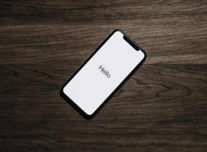 Black Phone on Brown Table