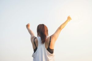 Woman Raising Both Hands