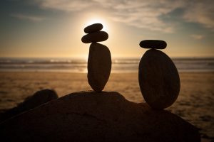 balanced stones at sunset