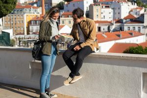 Two tourists using a map