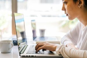 woman looking at laptop screen