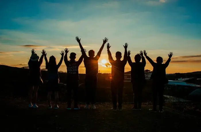 silhouette of people at sunset