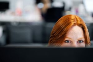 woman focused on computer screen