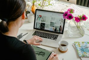 Woman in workspace using a laptop