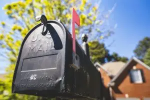 Close-up of US mailbox with red flag