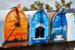 four painted mailboxes