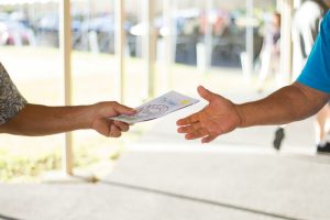 person holding brochure