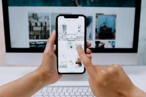 Hands holding a smartphone while browsing