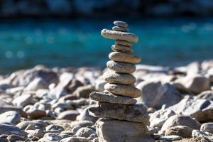 rocks balance with ocean in background