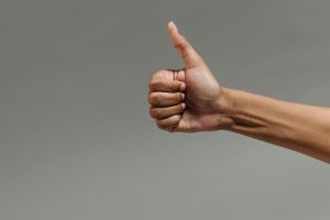 close-up of a hand making a thumbs up sign