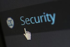 Mouse cursor over digital security text on screen
