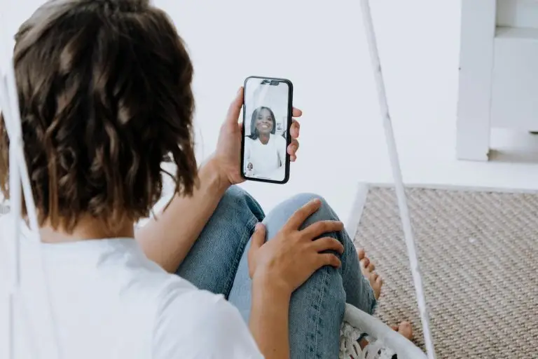 women engage in video chat on smartphone