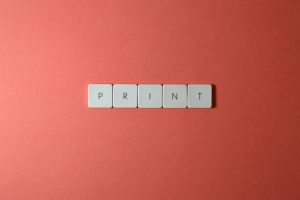 wooden tiles spell 'PRINT'