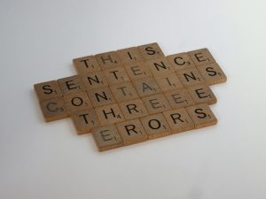 wooden tiles wrong spelling on white table
