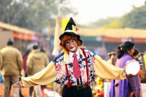 Clown joyfully entertains people at a festival