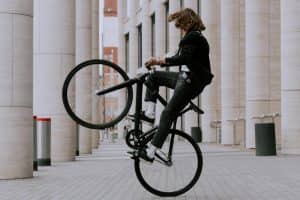 Action shot of a man doing a bicycle wheelie