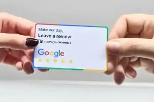 two hands holding business card - patient reviews