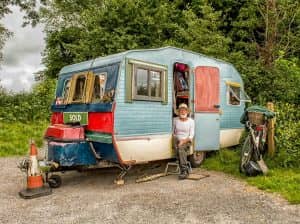 Vintage caravan with elderly man outdoors