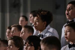 Group of diverse boys singing in a choir