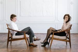 Man and woman in professional consultation setting