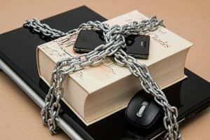 Chain-locked book, phone, and laptop