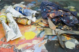messy paint and paint brushes