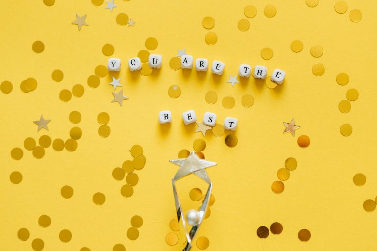 'You Are the Best' message and star confetti on a golden background.