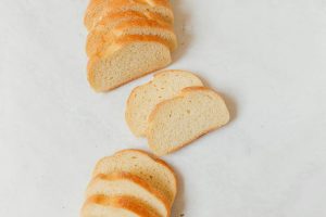 Sliced white bread arranged on a light background
