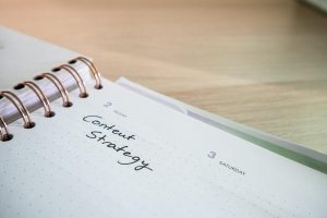 Close-up of a notebook page with 'Content Strategy' written on it