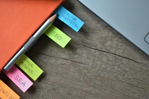 Close-up of SEO strategy planner with colorful sticky notes